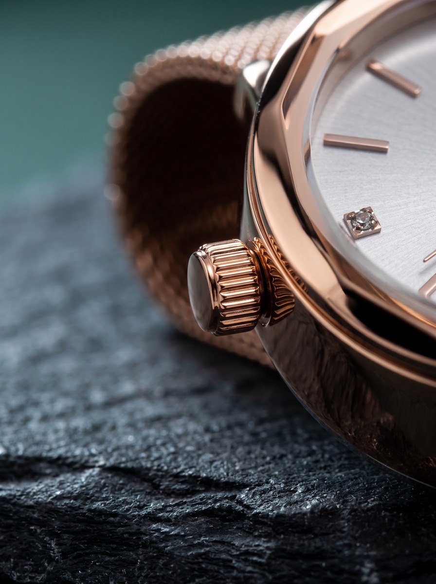Close watch detail in a flat-lay composition.