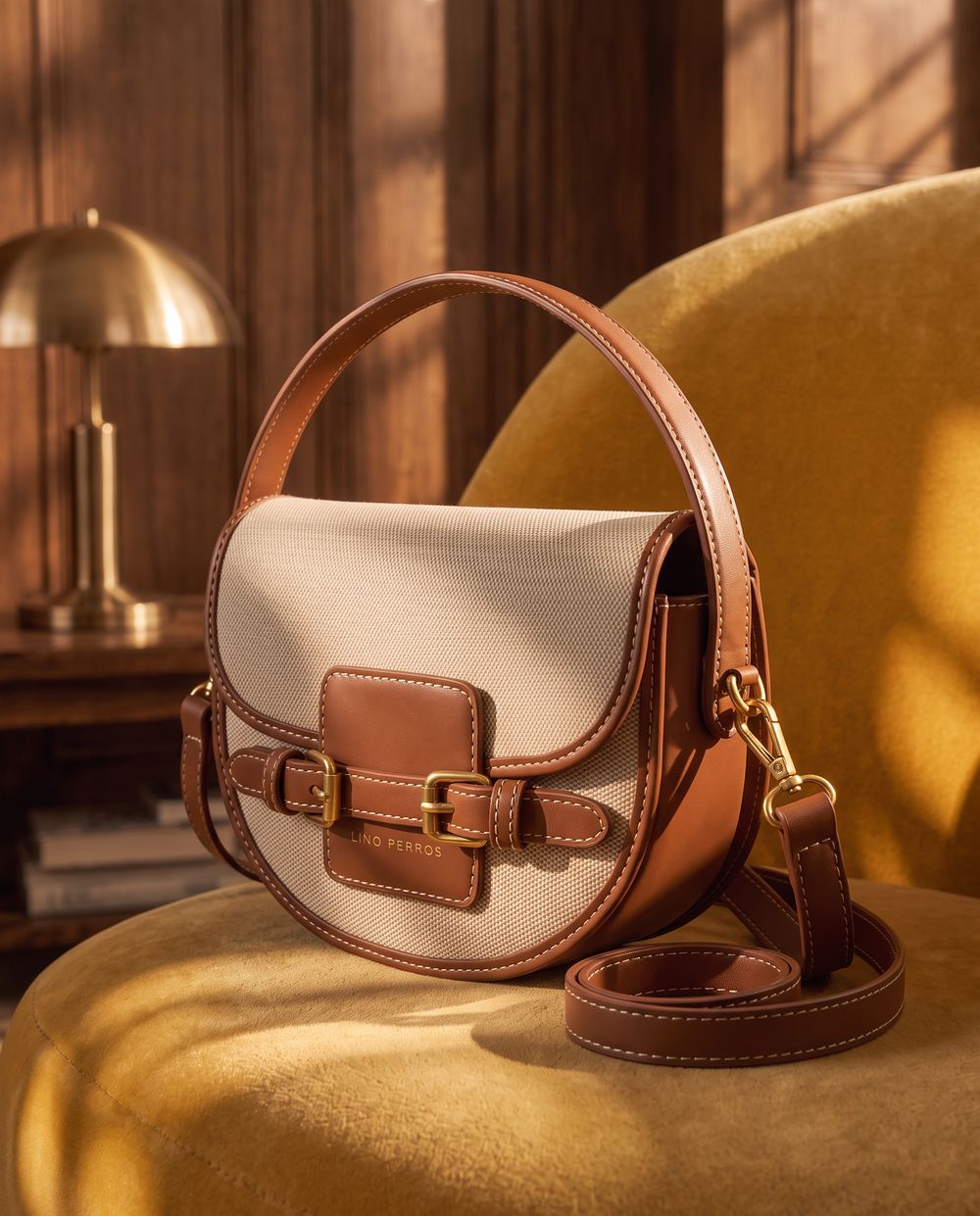 The same bag on a mustard velvet chair in warm afternoon light.