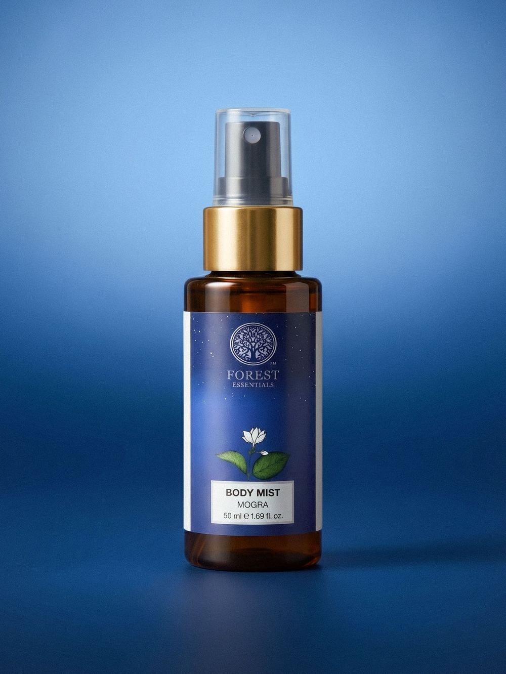A single body-mist bottle on a blue gradient.