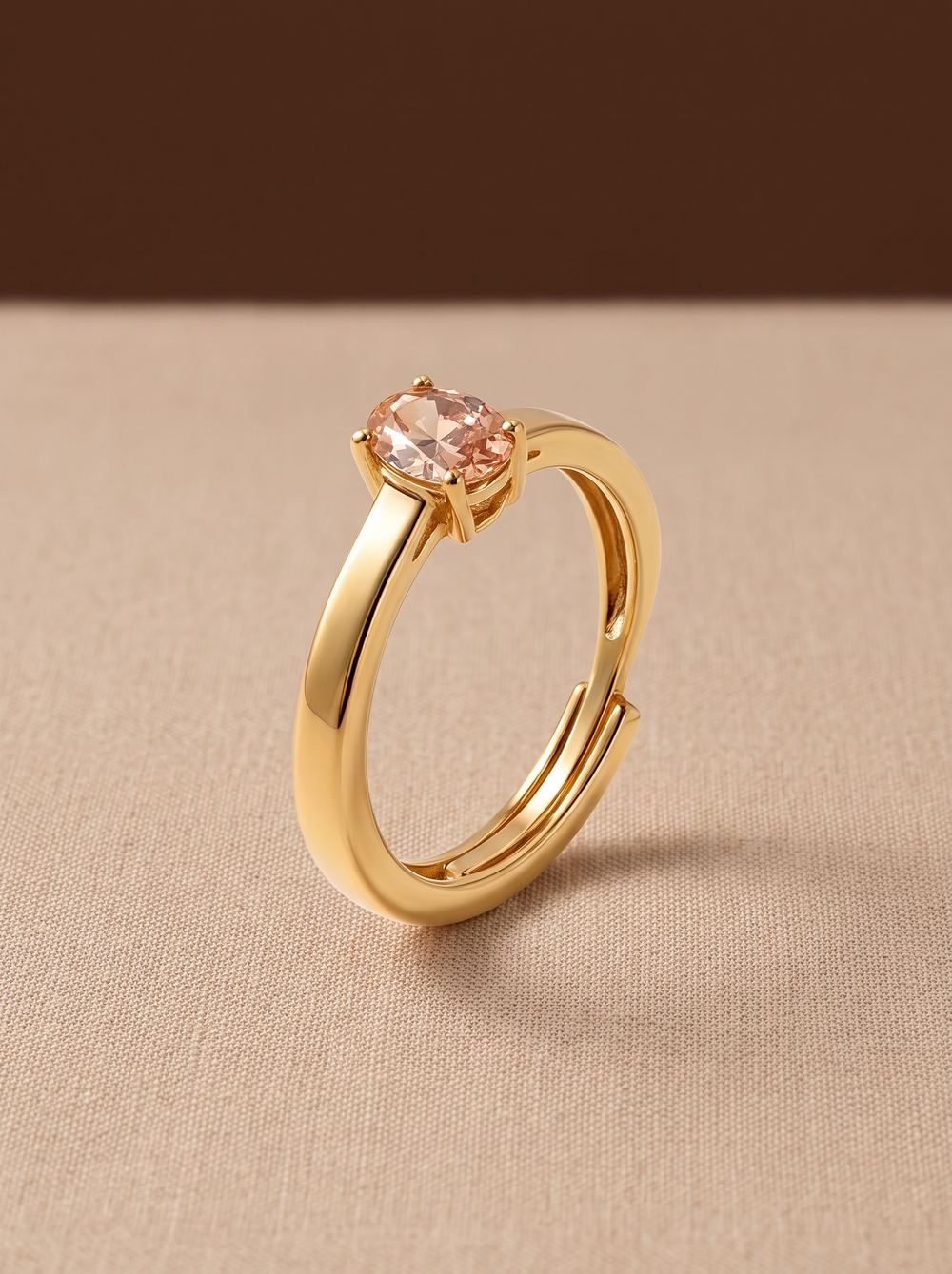 Gold solitaire ring set with a pale morganite stone.